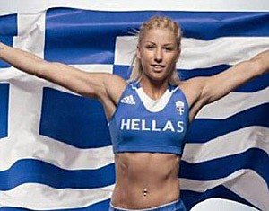 greek woman holding greek flag