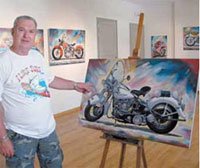 painter konstantinos kostoulas showing a motorbike painting