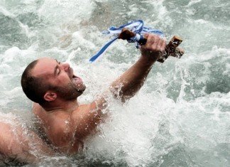 man retrieved the cross from the sea in Greece